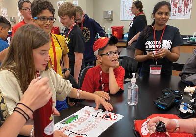 Students doing lab research during a Dakota Dreams camp event.