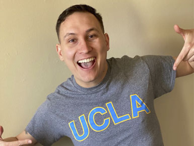 Blake Warner wearing a UCLA shirt celebrating his match.