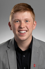 Headshot of Carter Linke. He's wearing a suit.