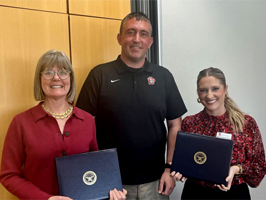 From left to right, Susan Hackemer, Joseph Knoer and Ashlin Schoenfelder pose with the Patriotic Awards.
