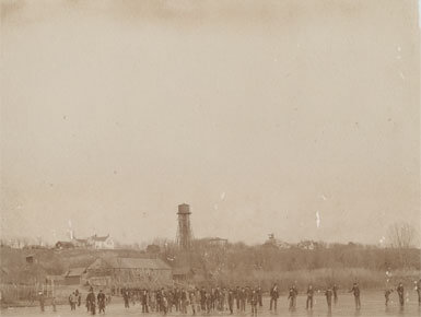 A game of ice hockey on the frozen Vermillion River, 1864.