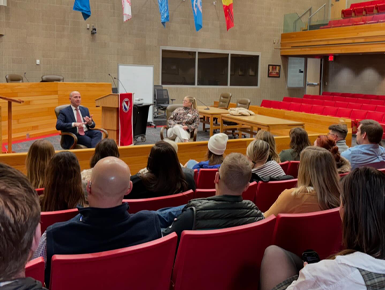 Dean Neil Fulton, J.D., and Katey Ulrich, director of admissions and marketing at the USD Knudson School of Law, host the 2025 Leadership South Dakota class in the Knudson School of Law.