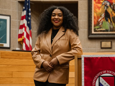 Angelica Cruz standing next to podium