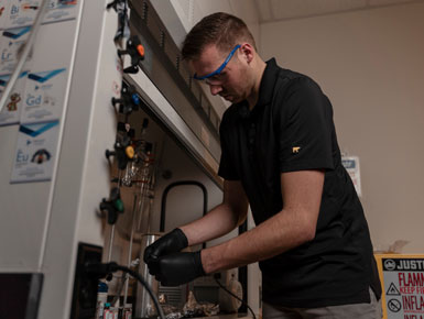 A photo of Brady Samuelson working in a lab.