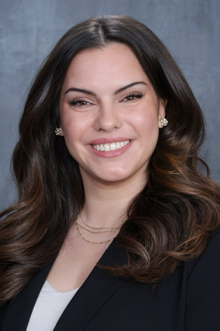 A headshot of Clara MacIlravie Cañas.