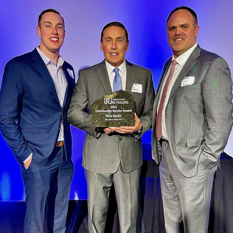 Pharis family accepts award