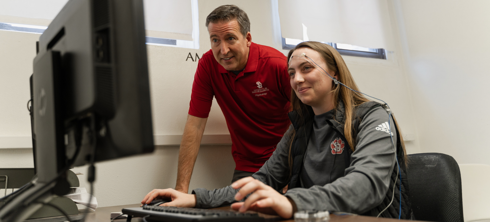 A USD Neuroscience student and professor doing live research.