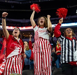 Coyote Crazies cheering in the stands at a Coyote women's basketball game